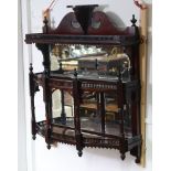 A set of Victorian mahogany hanging open wall shelves with mirrored back, pierced galleries and