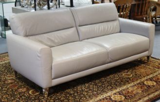 A Next grey leatherette three-seater settee on five square mirrored tapering legs, 196cm long.