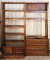 A mahogany-finish tall wall unit fitted with an arrangement of drawers, cupboards & open shelves,