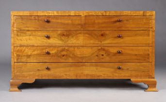 A continental-style walnut dwarf double chest fitted two short & three long drawers with turned knob