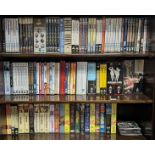 A collection of assorted CDs, DVDs; & video cassette tapes.