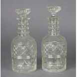 A pair of late 19th/early 20th century cut-glass decanters in the Regency style, 25cm high.