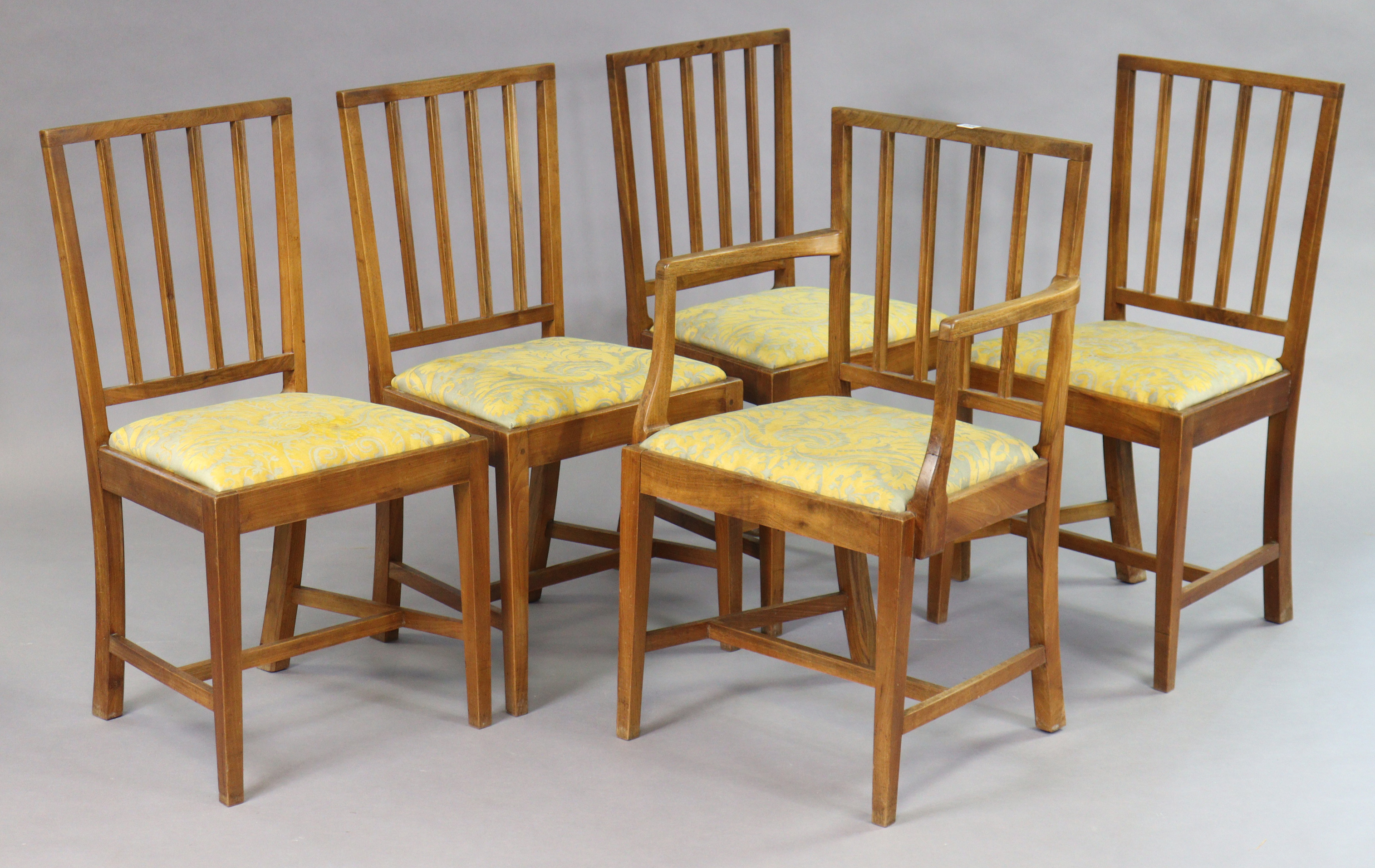 A set of five mid-20th century Cotswold School walnut dining chairs by Charles Herbert (Bert) Uzzell