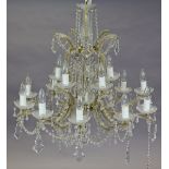 A 20th century glass 10-branch chandelier of two concentric tiers hung with prism drops, 73cm wide x