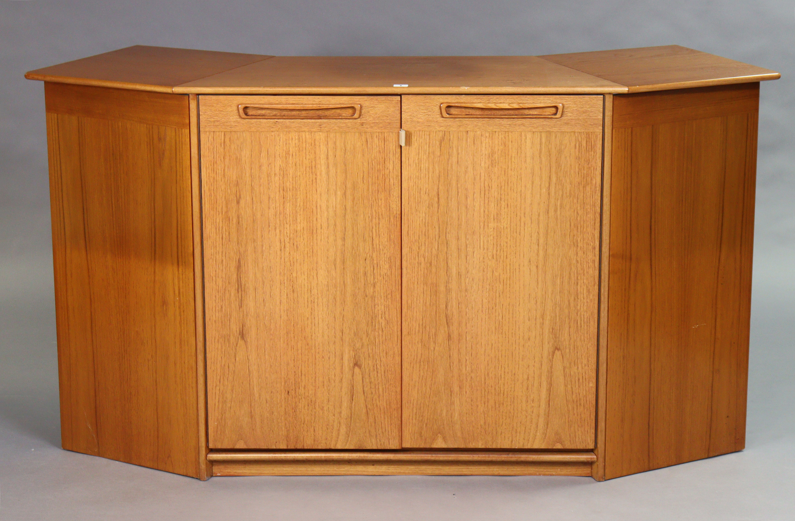 A mid-20th century teak drop-leaf drinks cabinet, side cabinet with two adjustable shelves