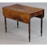 A 19th century mahogany Pembroke table fitted with an end drawer, & on four ring-turned tapered