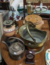 An Edwardian brass oil table lamp with an orange mottled glass reservoir & on a black ceramic