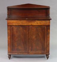 A 19th century mahogany chiffoniere with an open shelf to the stage back, fitted frieze drawer above