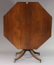 A 19th century mahogany pedestal dining table with an octagonal tilt-top; on centre column & four