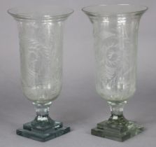 A pair of Victorian-style cut-glass candle holders, of trumpet form with foliate decoration & on