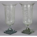 A pair of Victorian-style cut-glass candle holders, of trumpet form with foliate decoration & on
