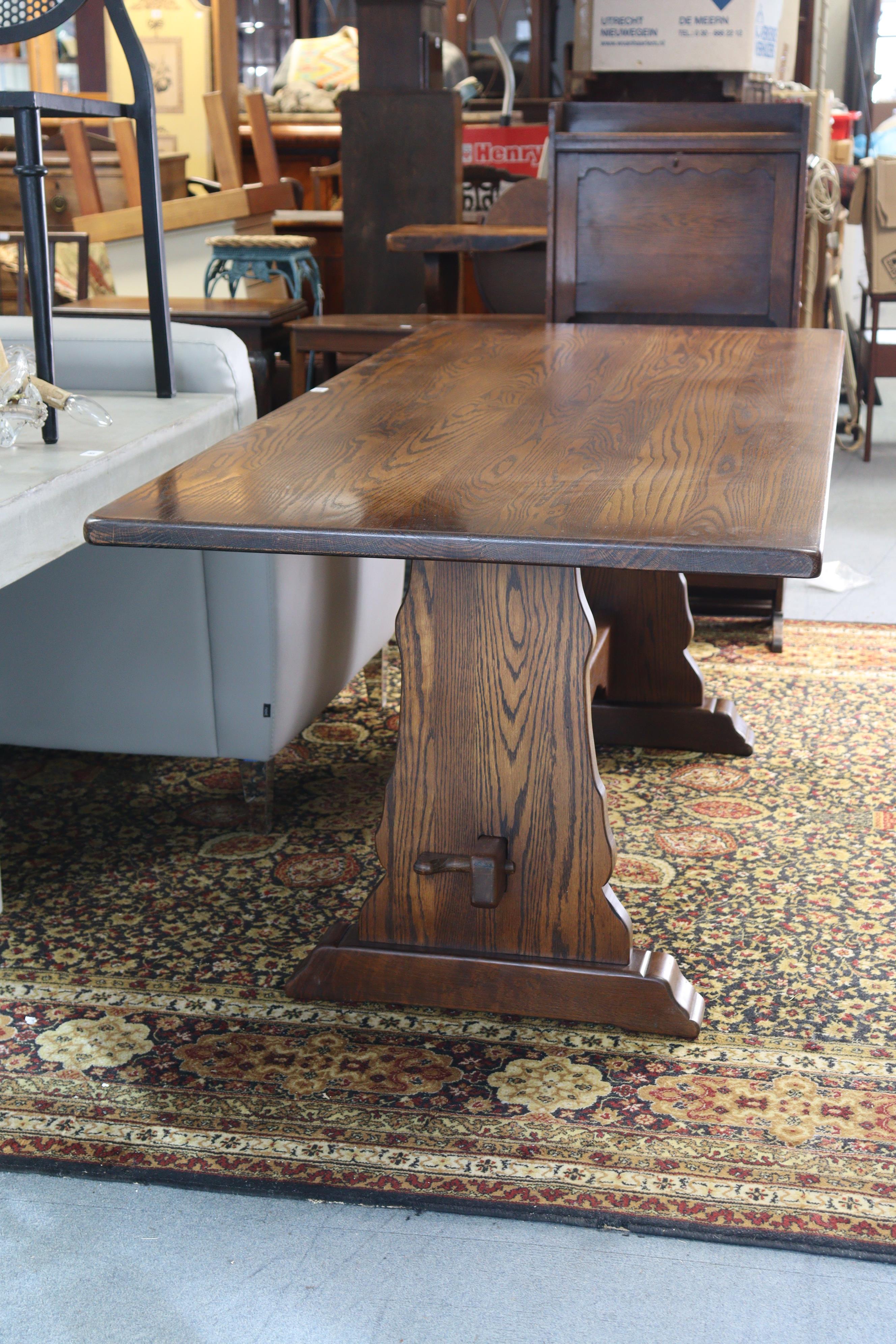 An oak refectory table with a rectangular top, & on shaped end supports joined by a shaped centre - Image 2 of 4