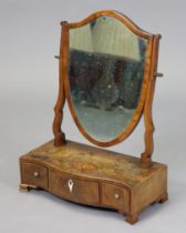 A Georgian inlaid mahogany shield-shaped swing dressing table mirror, with shaped supports and