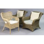 A pair of wicker conservatory armchairs, each with loose cushions to the seat & back; and another