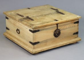 A Mexican pine & iron-bound large wooden storage trunk with a double hinged lift-lid, iron ring side