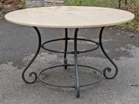 A black finish wrought-iron garden table on four scroll supports with tubular stretchers, & with a