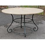 A black finish wrought-iron garden table on four scroll supports with tubular stretchers, & with a