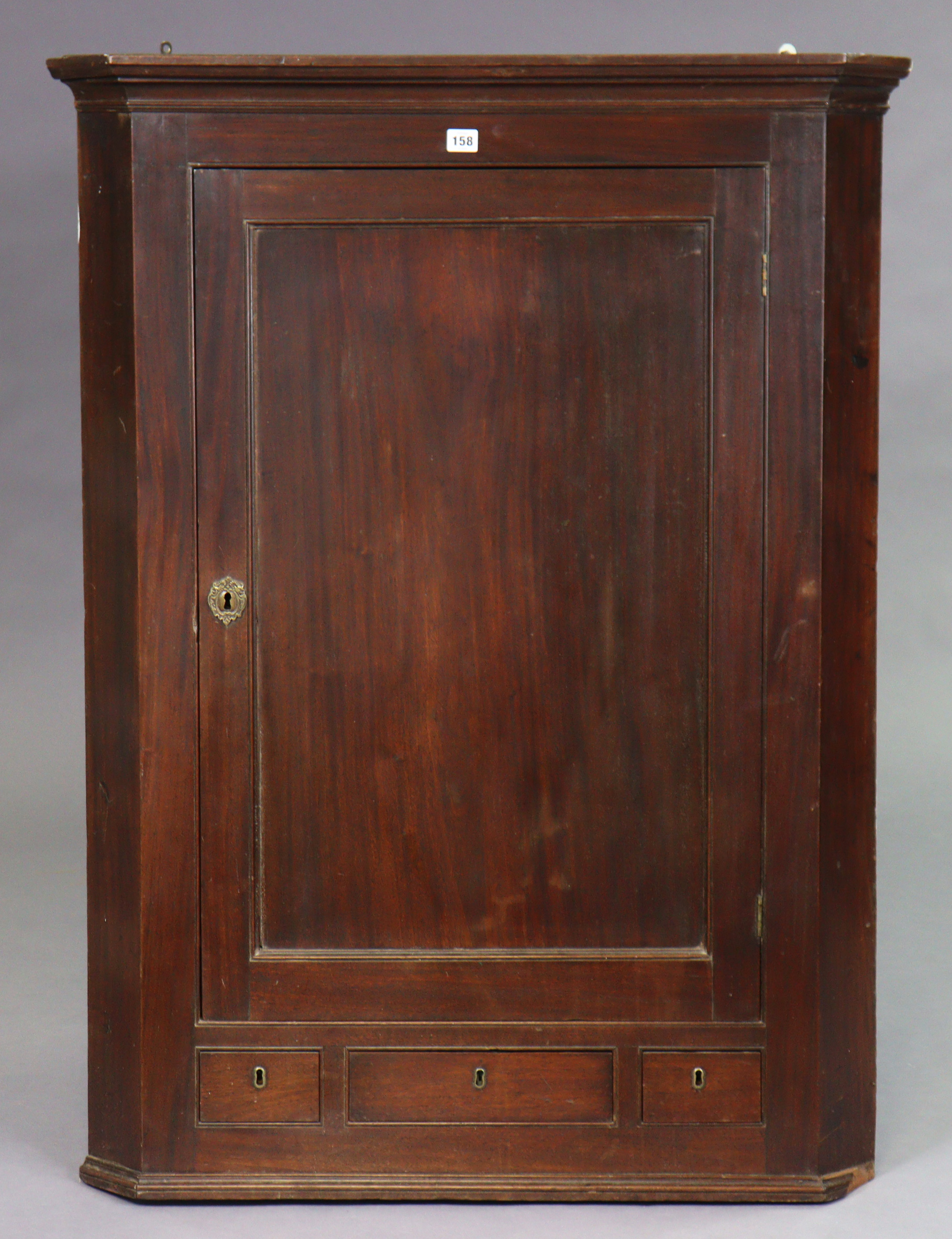 A 19th century mahogany large hanging corner cabinet with three small drawers, 91cm wide x 120.