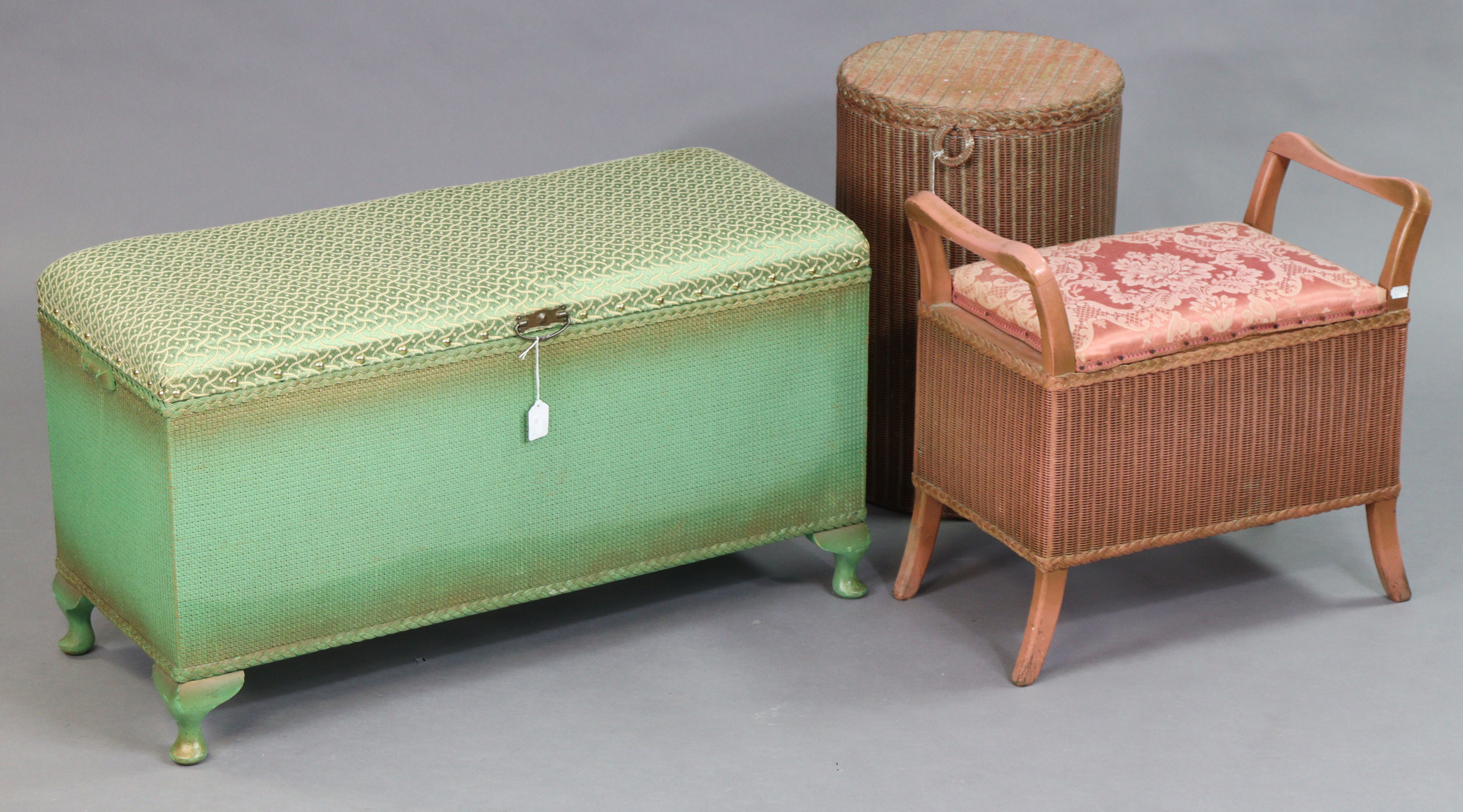 A Lusty’s Lloyd Loom pink painted cylindrical linen box; a similar Sirram box-seat stool; & a