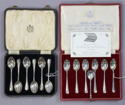 A set of six silver “City Sets” teaspoons; another set of silver teaspoons, both sets cased; & a