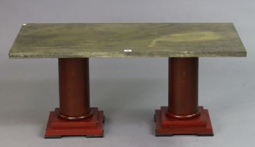 A continental-style coffee table on cylindrical end supports & square block feet, & with a painted