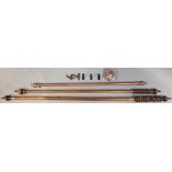 Three stained wooden large curtain poles, 300cm, 268cm, & 214cm long, each with fittings.