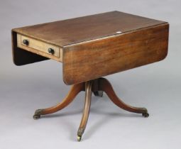 A 19th century mahogany drop-leaf sofa table fitted with an end drawer, & on a vase-turned centre