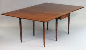 A 19th century mahogany drop-leaf dining table on six ring-turned tapered legs, 122cm wide x 73cm