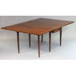 A 19th century mahogany drop-leaf dining table on six ring-turned tapered legs, 122cm wide x 73cm