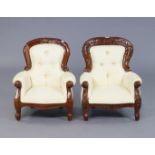 A pair of Victorian-style buttoned-back child’s armchairs each on cabriole legs.