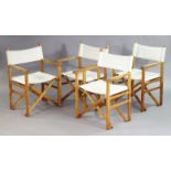 A set of four folding director’s chairs.