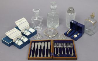 An Orrefors glass decanter; a Victorian glass decanter; another glass decanter; three glass ashtrays