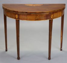 A late 18th century mahogany and satinwood crossbanded demi-lune card table with fold-over top,