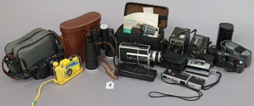 A pair of Zenith “Continental” 10 x 55mm field glasses, cased; & various cameras & accessories.