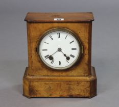 A late Victorian mantel clock with black roman numerals to the 13cm white enamel dial, having a