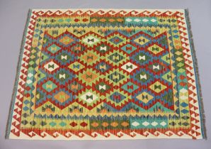 A kelim rug with repeating multicoloured geometric design surrounded by multiple borders, 202cm x