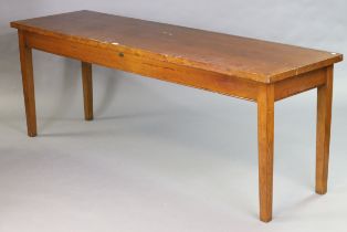 An oak dining table by Renofurn Ltd. of Shoreditch with a rectangular top, & on four square tapered