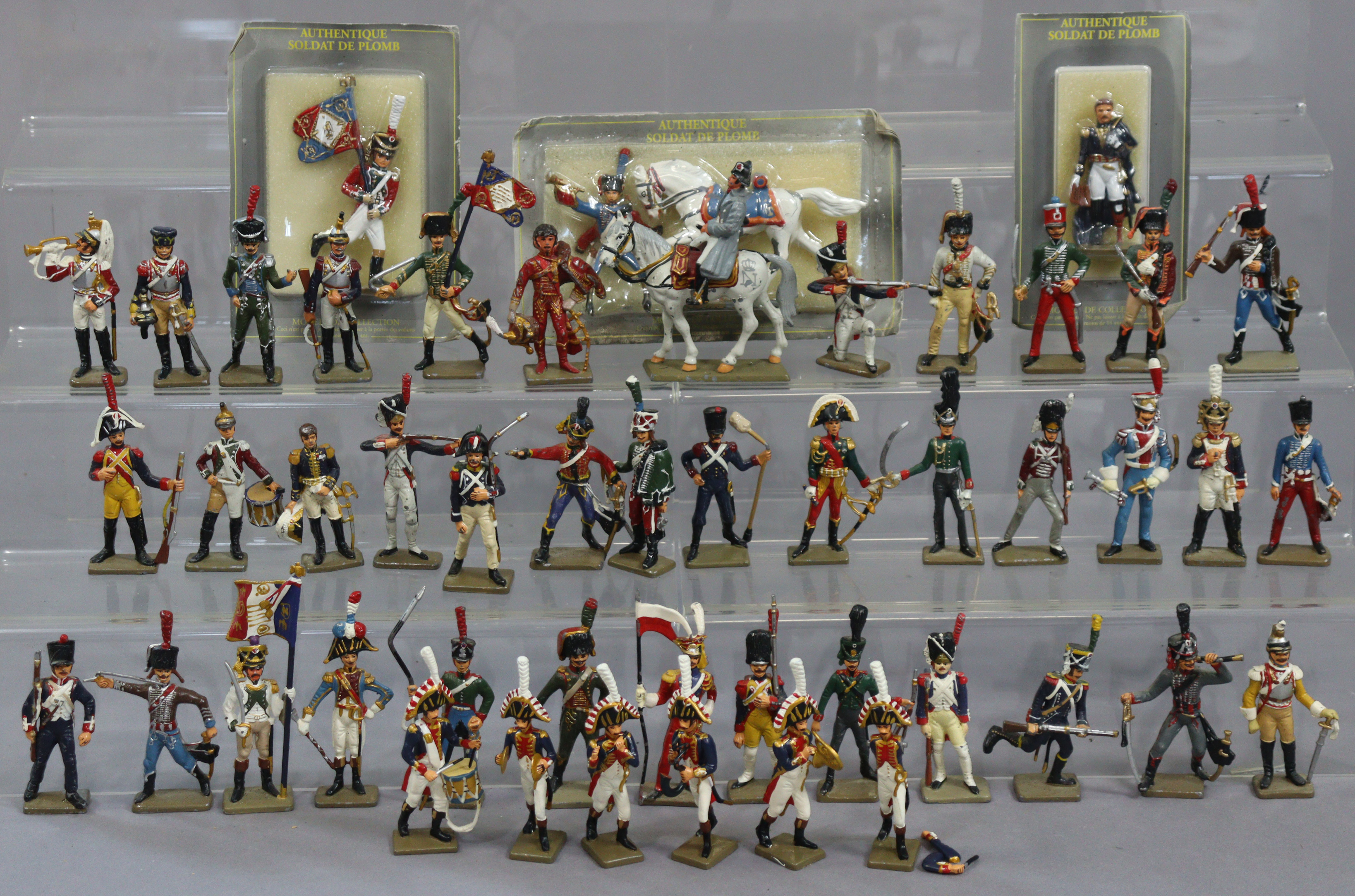 Various painted lead soldier models, some with original packaging.