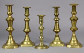 An 18th century brass candlestick, 20cm high; two pairs of Victorian candlesticks, 26.5cm & 24.5cm