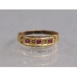 A 15ct. gold ring set row of three small rubies separated by two seed pearls; size: P; 1.7gm.