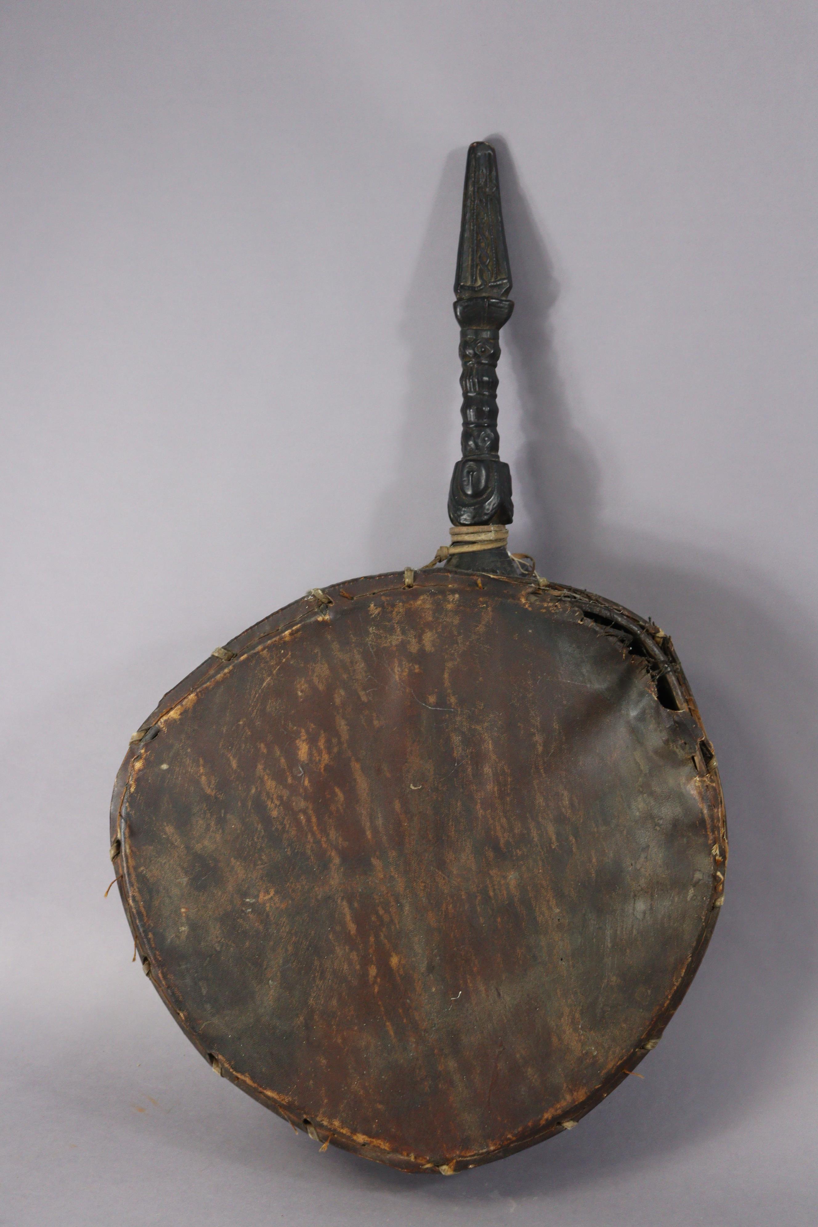 A Nepalese shaman’s drum or Dhyango having an ebonised & carved wooden handle, 44cm diameter x - Image 4 of 6