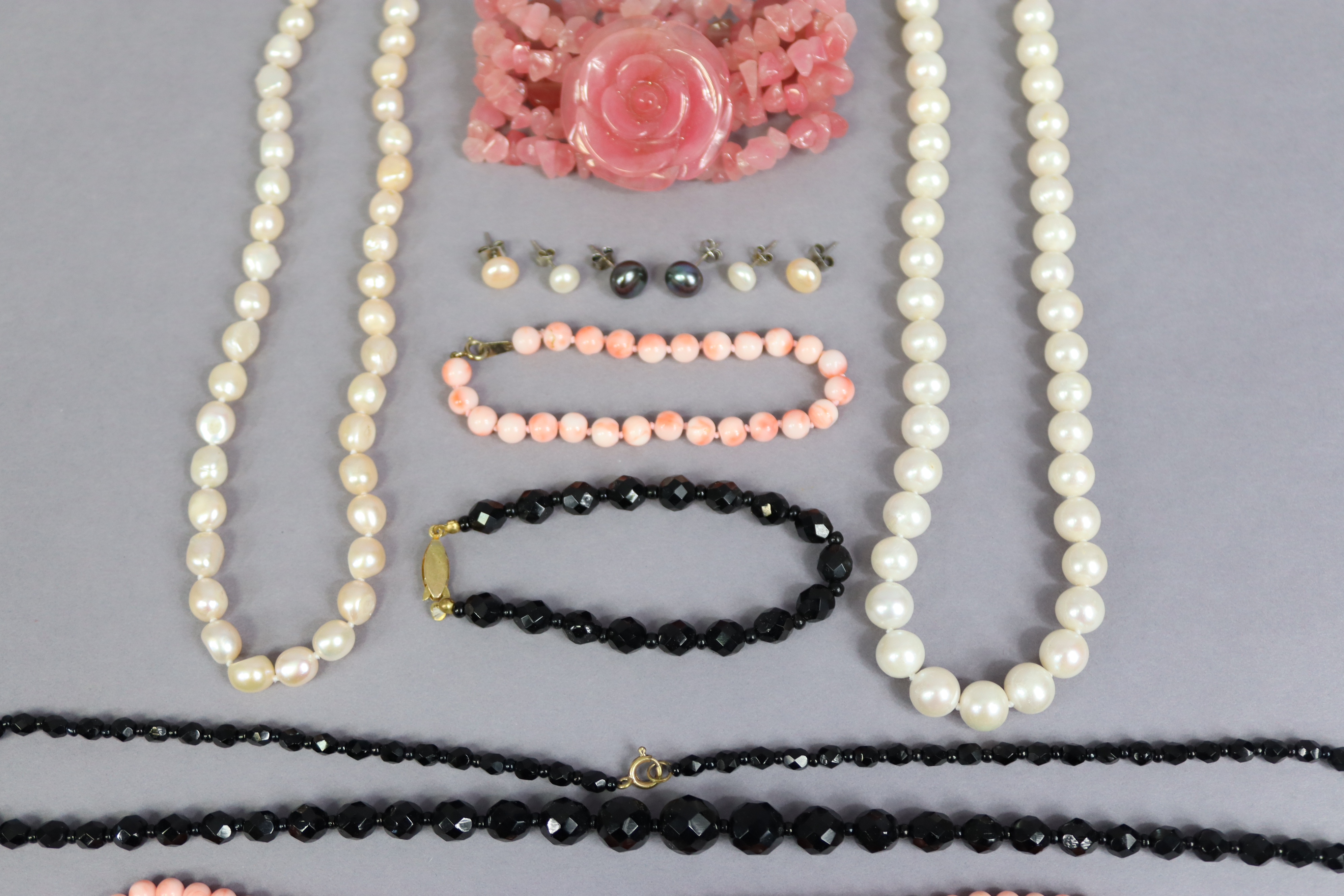 Two pearl necklaces, 43cm & 42.5cm long; a coral necklace, 40cm long; a jet necklace, 60cm long, - Image 3 of 4