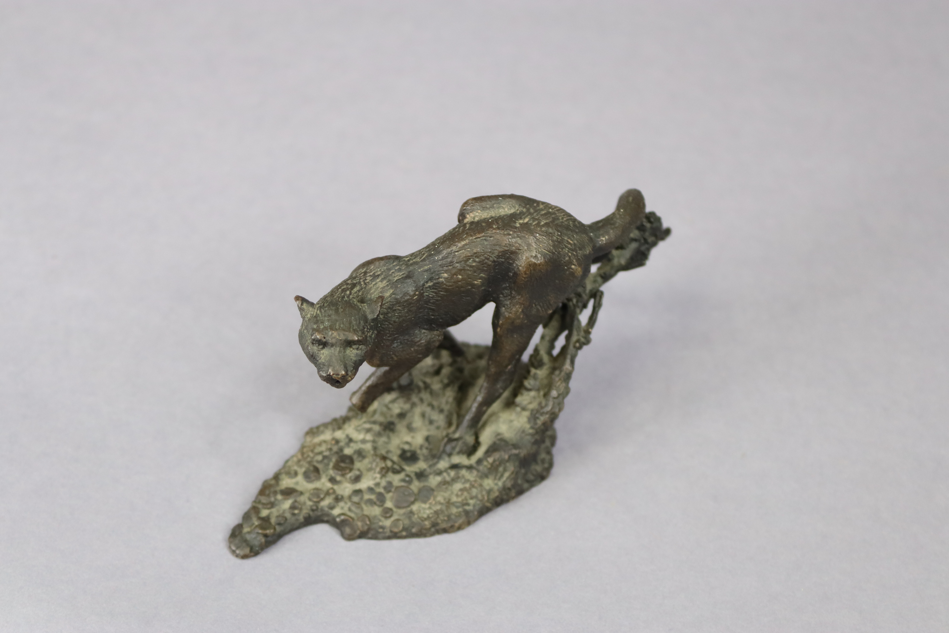 A small, bronzed ornament in the form of a wild cat, signed Mene, 13cm wide x 6.75cm high. - Image 2 of 4