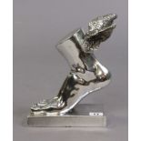 A silvered-finish composition “Mercury winged foot” on a rectangular plinth base, 24.5cm high.