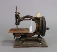 A late 19th century “Monarch” sewing machine by Smith & Co. of London, 28.5cm long, uncased.