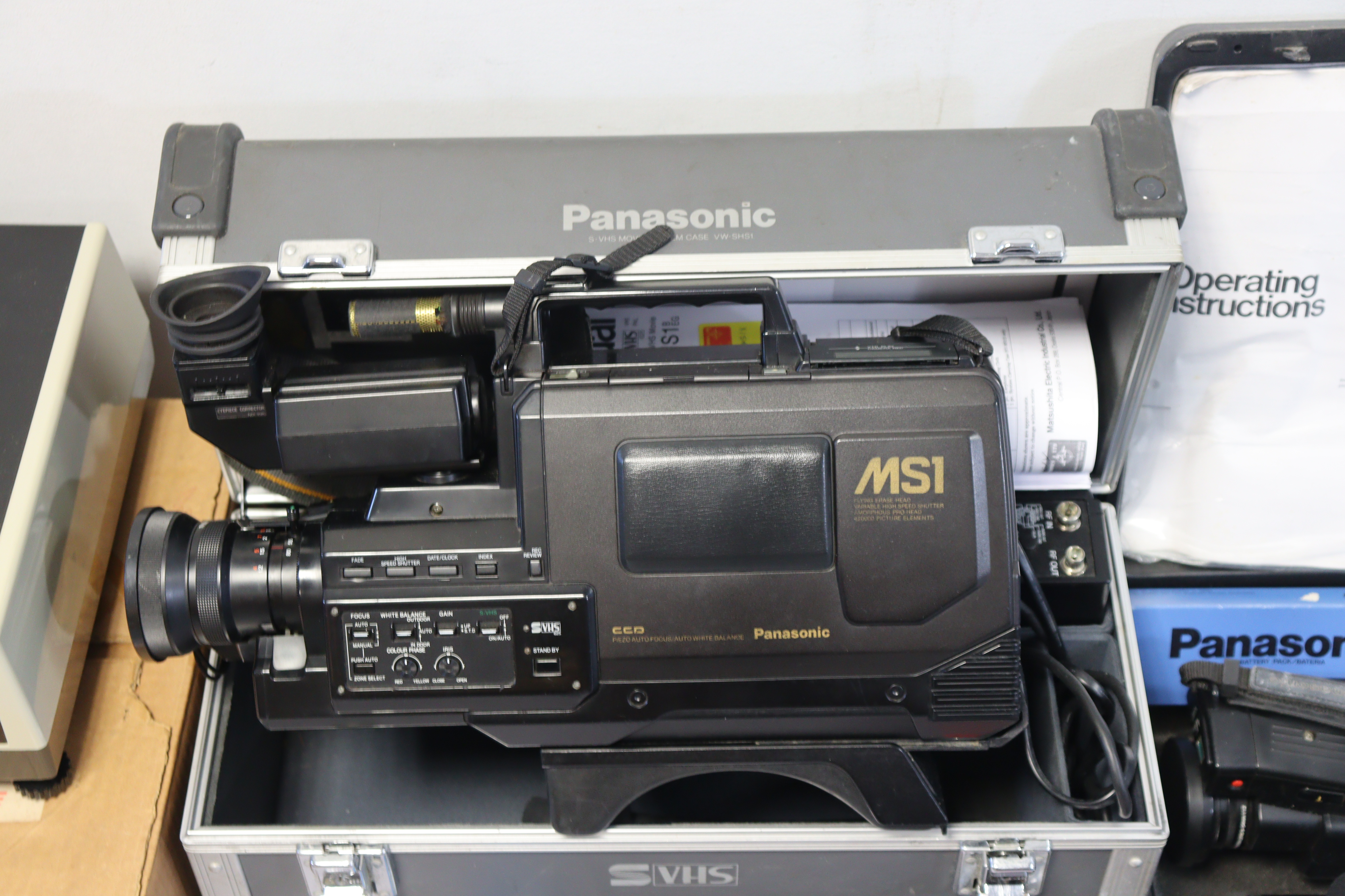 Two Panasonic VHS movie cameras, both cased, a Jaguar slide-projector, boxed, and various circular - Image 2 of 4