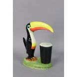 A Carlton ware “Guiness” toucan table lamp (requires rewiring), 21.5cm high.