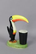 A Carlton ware “Guiness” toucan table lamp (requires rewiring), 21.5cm high.