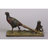 A cold painted bronzed novelty pheasant & three-stump match-striker on a rectangular base, 331cm