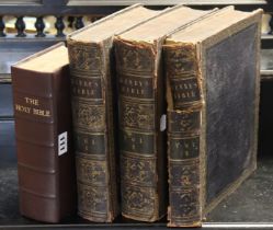 A set of three early 19th century leather-bound Henry’s Bibles; & a late 19th century leather-